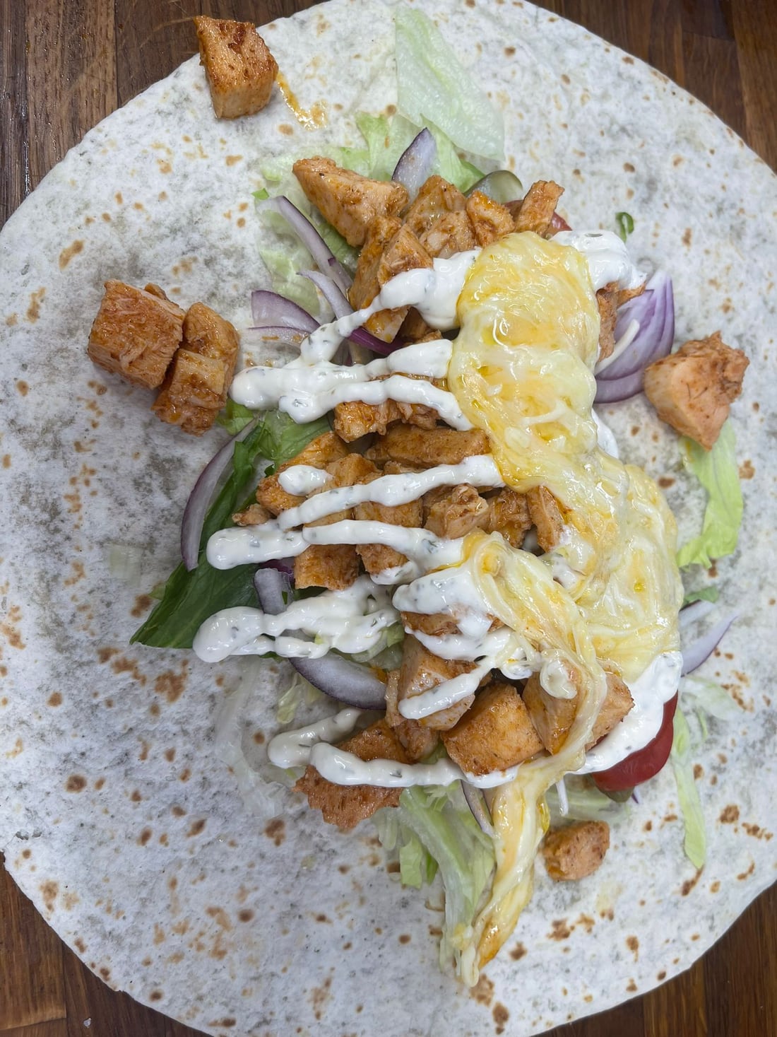 Chicken wrap with salad and sauce at the cafe